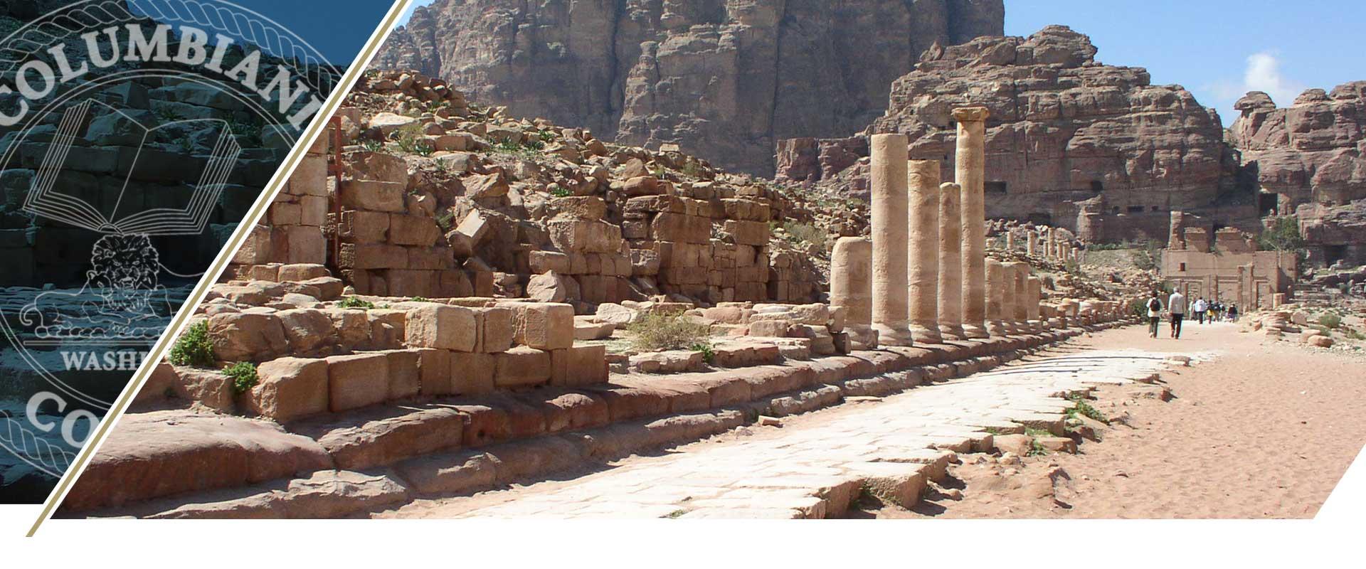 Ancient ruins with columns and walls and people walking in the distance. Columbian Colegii logo